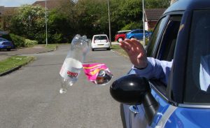 Litter being thrown from a car