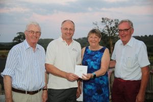 John Shepherd receiving donation