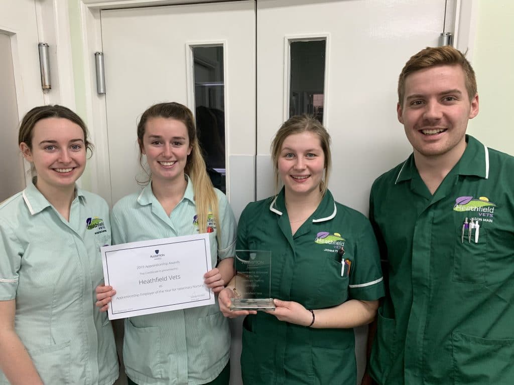 Heathfield Vets nursing apprentices holding their award