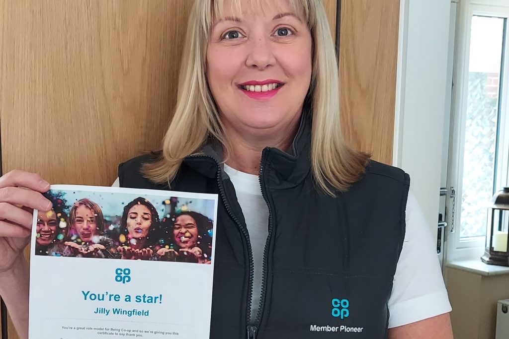 Photo of Jilly Wingfield holding certificate