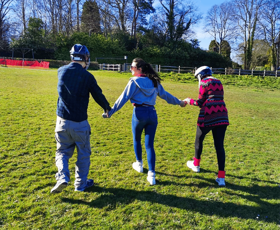 oakdown residents in a field with carers